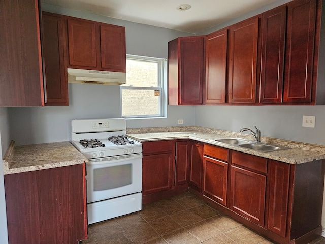 kitchen featuring gas range gas stove and sink