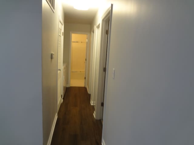 hall featuring dark hardwood / wood-style floors