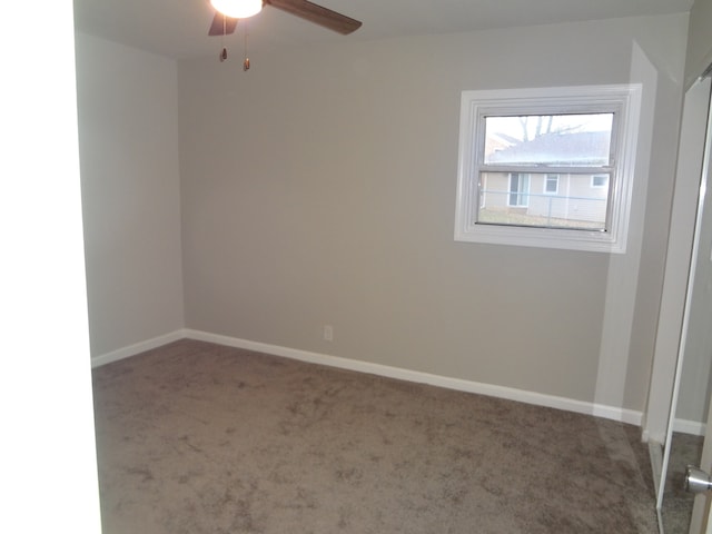 carpeted empty room with ceiling fan