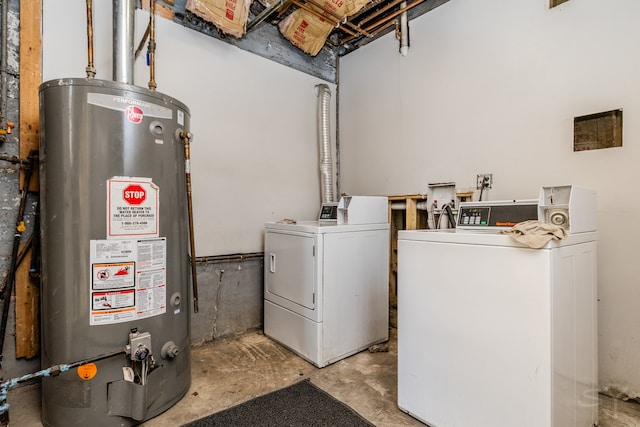 laundry room with water heater and independent washer and dryer