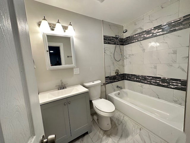 full bathroom with tiled shower / bath, vanity, and toilet