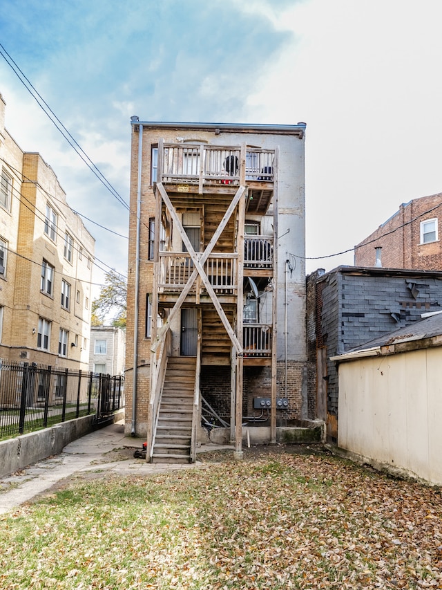 rear view of property with a balcony