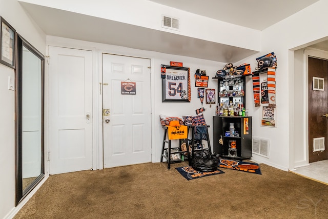 view of carpeted foyer