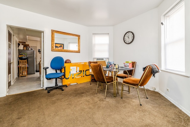 dining space with carpet flooring and plenty of natural light