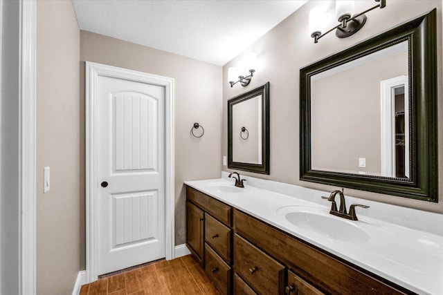 bathroom with vanity and a textured ceiling