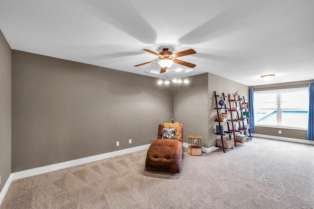 unfurnished room with ceiling fan and carpet floors