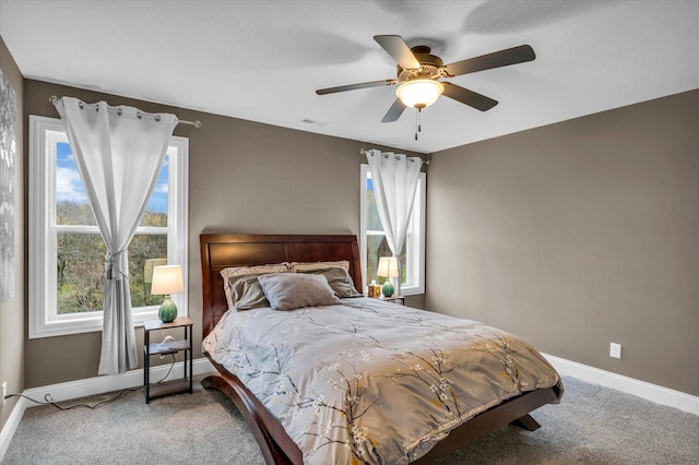 bedroom with ceiling fan and carpet floors