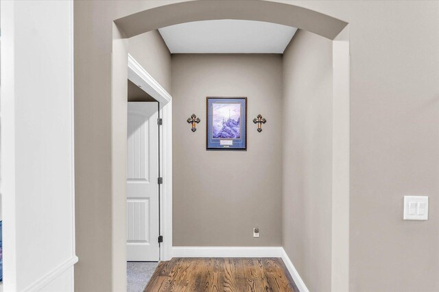 corridor featuring wood-type flooring