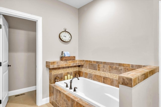 bathroom featuring a relaxing tiled tub