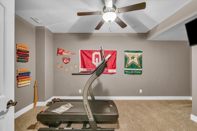 exercise room featuring ceiling fan and carpet floors