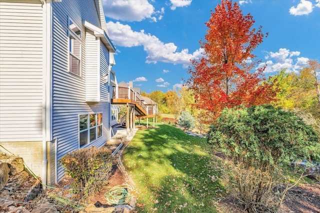 view of yard with a wooden deck