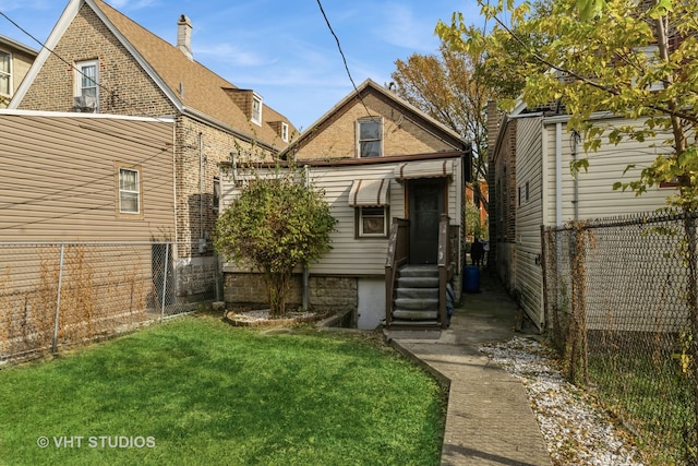 back of house with a yard