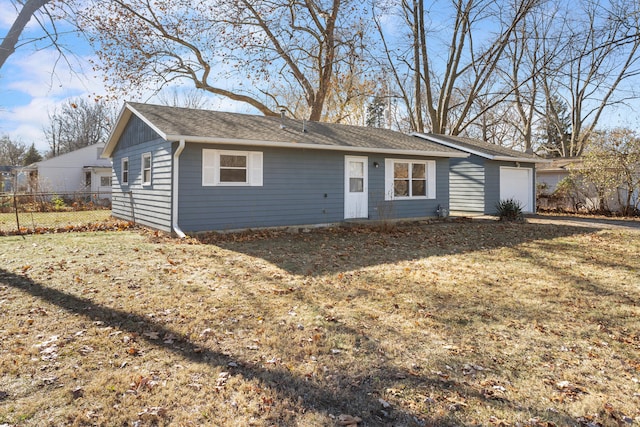 view of front of home with a garage and a front yard