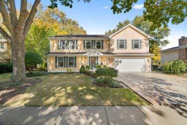 front of property with a garage