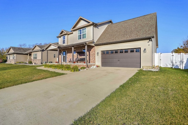 view of front facade featuring a front lawn, a garage, and a porch