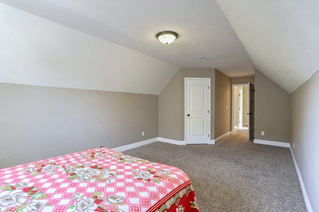 bedroom featuring carpet flooring and lofted ceiling