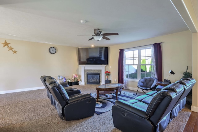 living room with hardwood / wood-style flooring and ceiling fan