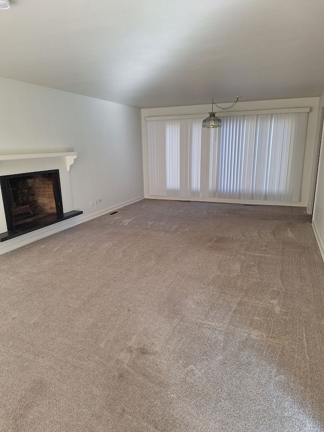 unfurnished living room with carpet