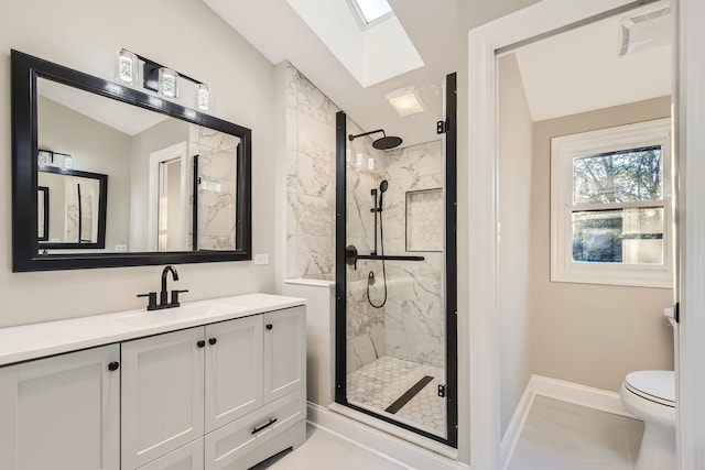 bathroom featuring a shower with door, toilet, tile patterned flooring, vanity, and lofted ceiling with skylight