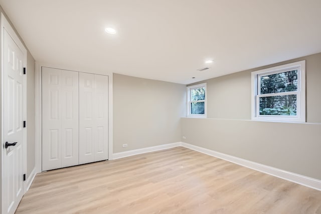 basement featuring light hardwood / wood-style floors