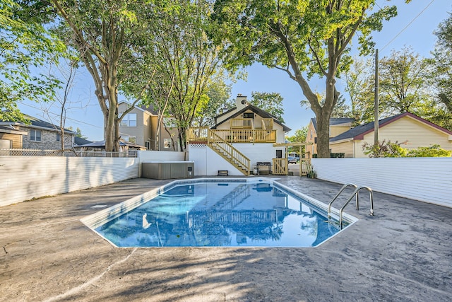 view of pool with a wooden deck