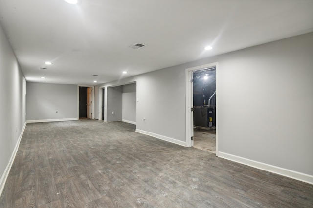 basement featuring dark hardwood / wood-style floors