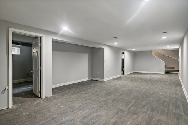 basement featuring dark wood-type flooring