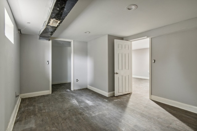 basement featuring dark wood-type flooring