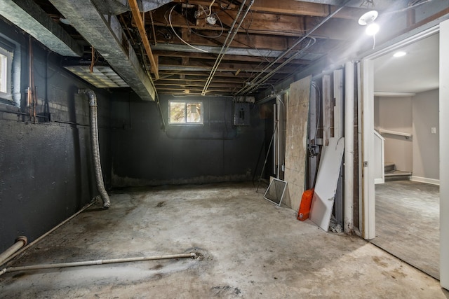 basement featuring electric panel