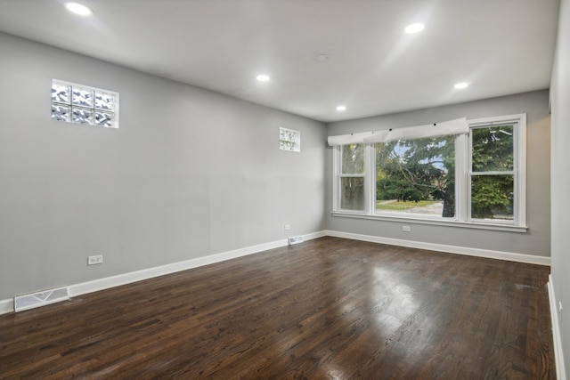 spare room featuring dark hardwood / wood-style floors