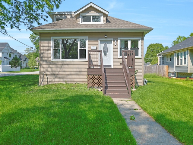 bungalow featuring a front yard