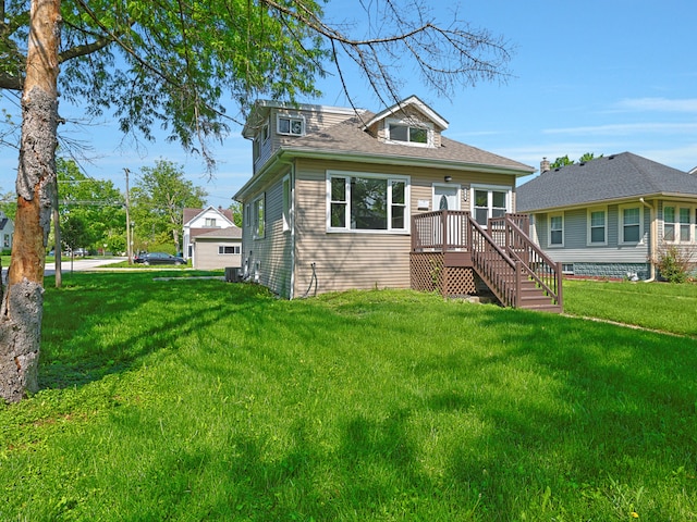 view of front of house featuring a wooden deck and a front lawn