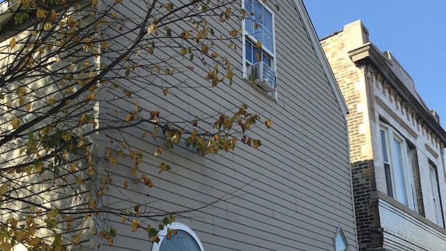 view of side of home featuring brick siding