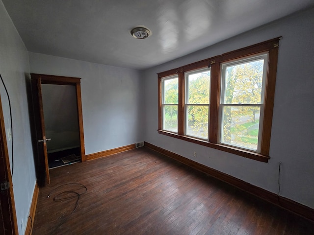 unfurnished bedroom featuring dark hardwood / wood-style floors