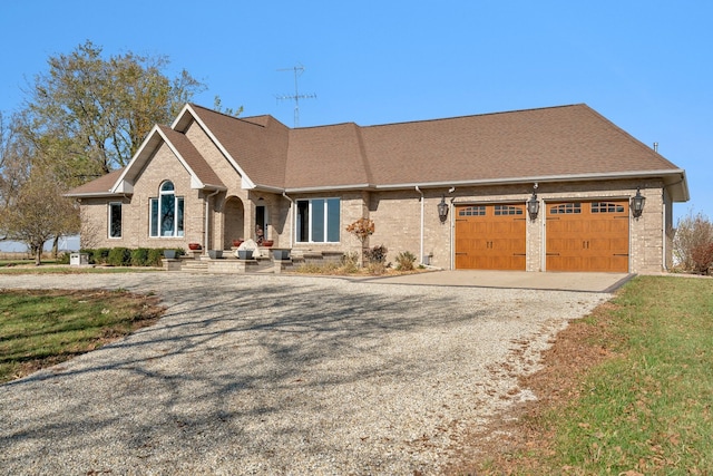 view of front of home with a front lawn and a garage