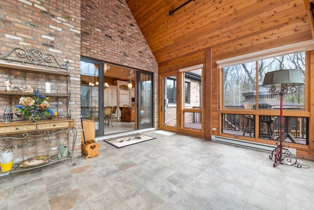 unfurnished sunroom featuring vaulted ceiling and wooden ceiling