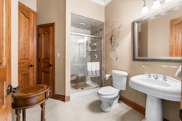 bathroom with toilet, walk in shower, and tile patterned flooring