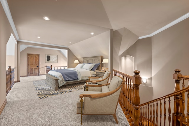 carpeted bedroom featuring crown molding and lofted ceiling