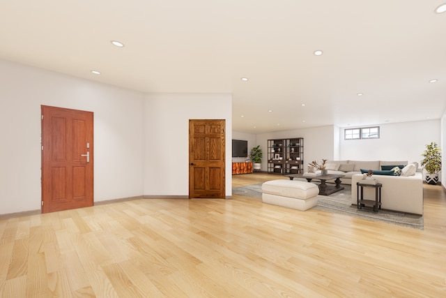 unfurnished living room featuring light hardwood / wood-style flooring