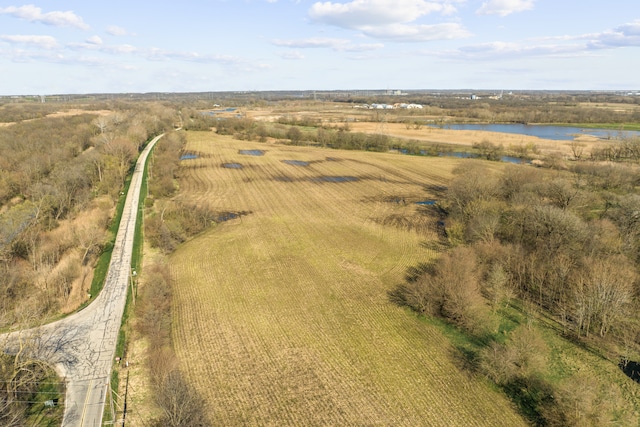 birds eye view of property with a water view and a rural view