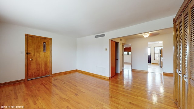 unfurnished room featuring light wood-type flooring