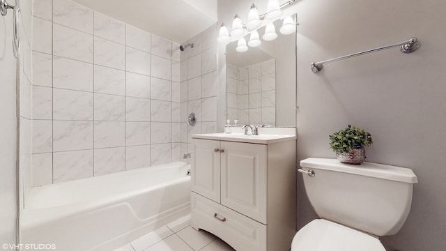 full bathroom featuring vanity, tiled shower / bath combo, toilet, and tile patterned floors