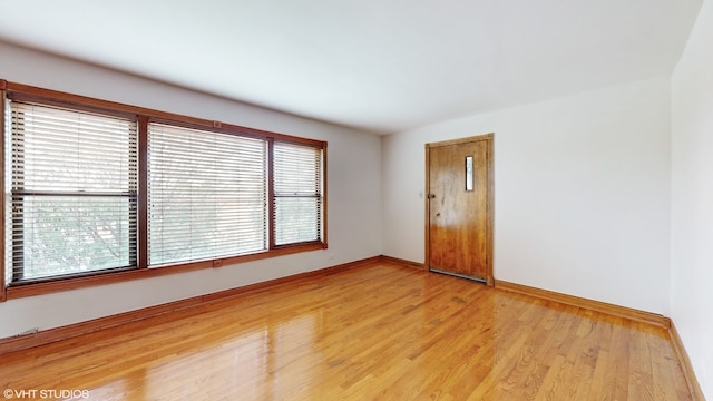 unfurnished room with light hardwood / wood-style flooring and plenty of natural light