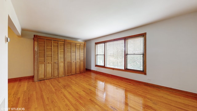 unfurnished bedroom featuring light wood-type flooring