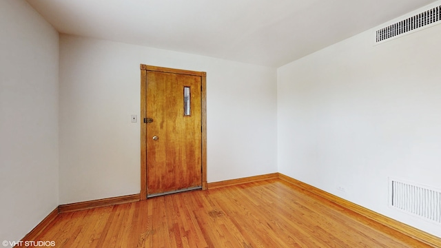 unfurnished room featuring hardwood / wood-style floors