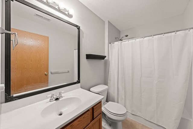 bathroom featuring vanity, a shower with shower curtain, tile patterned flooring, toilet, and a textured ceiling