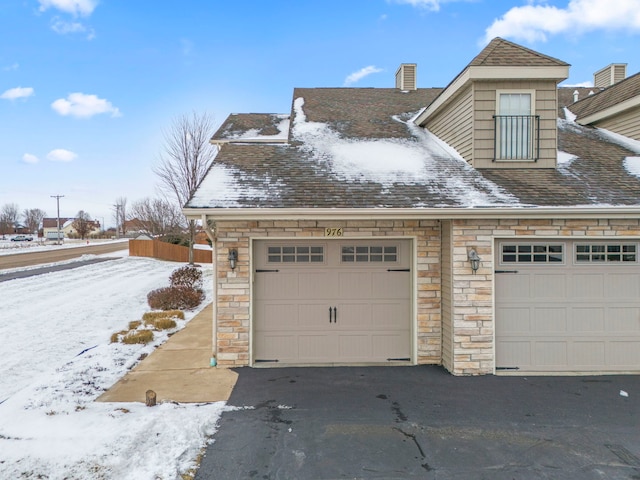 view of snow covered garage