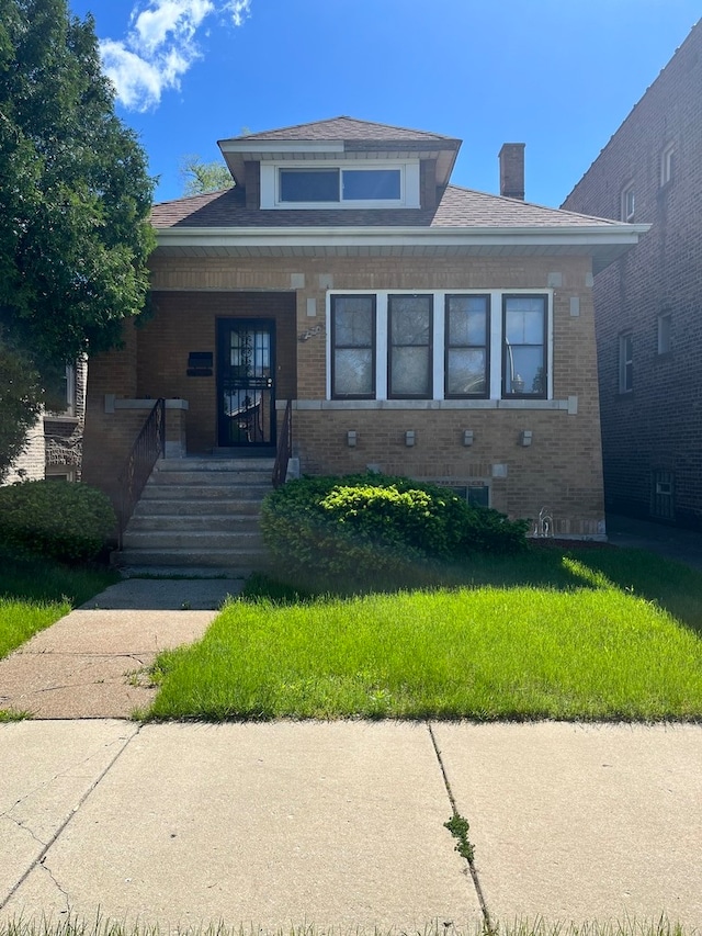 view of front of home with a front yard