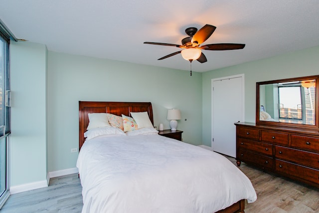 bedroom featuring light hardwood / wood-style flooring and ceiling fan