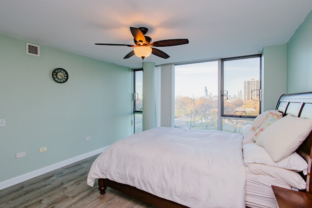 bedroom featuring ceiling fan and hardwood / wood-style floors